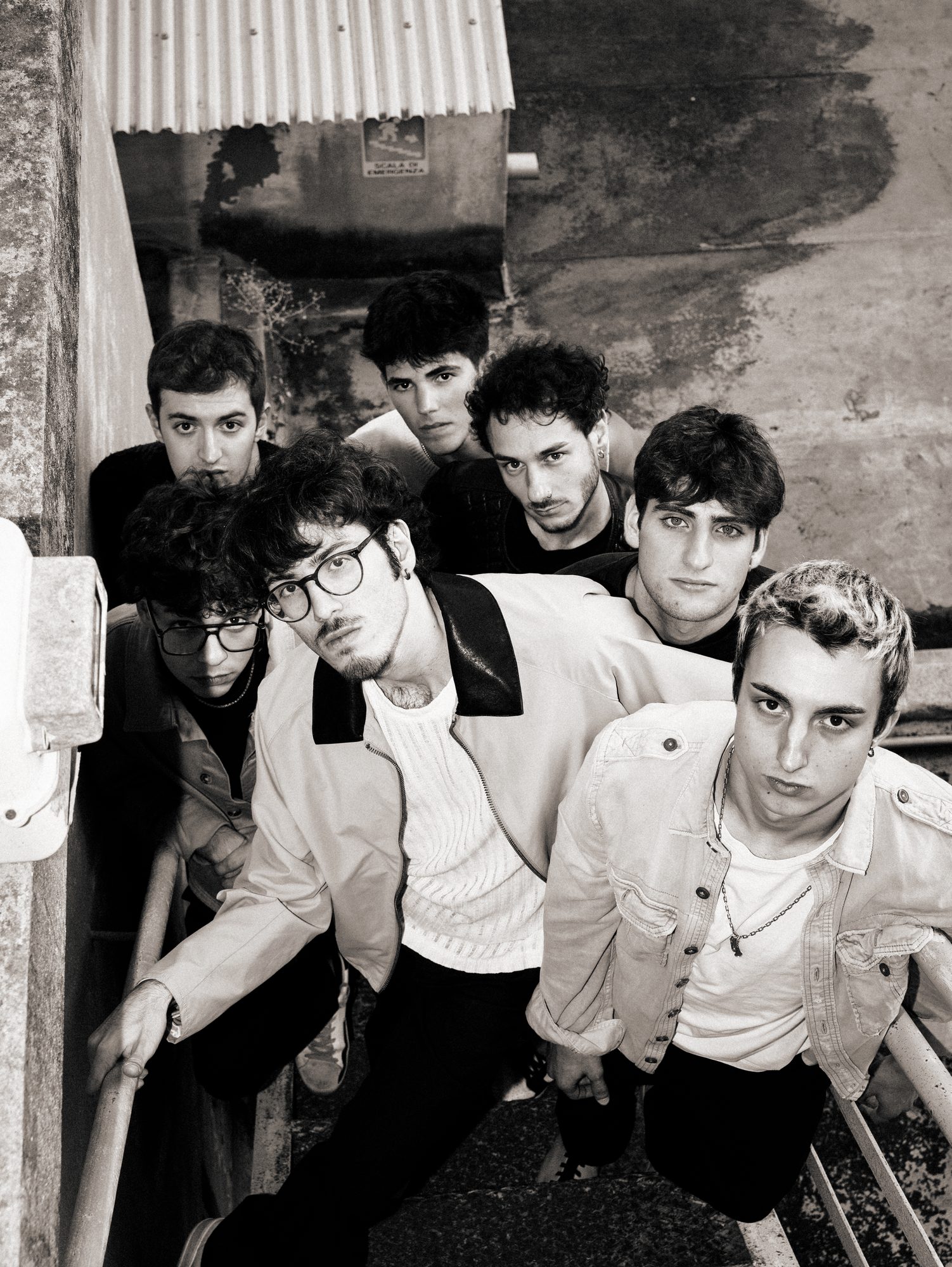 The band on an outdoor staircase, black and white